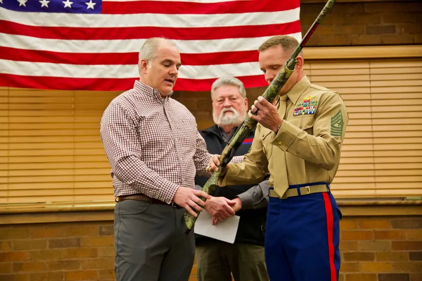 Sgt Maj. Bradley S. Driver, USMC receives a new Winchester shotgun