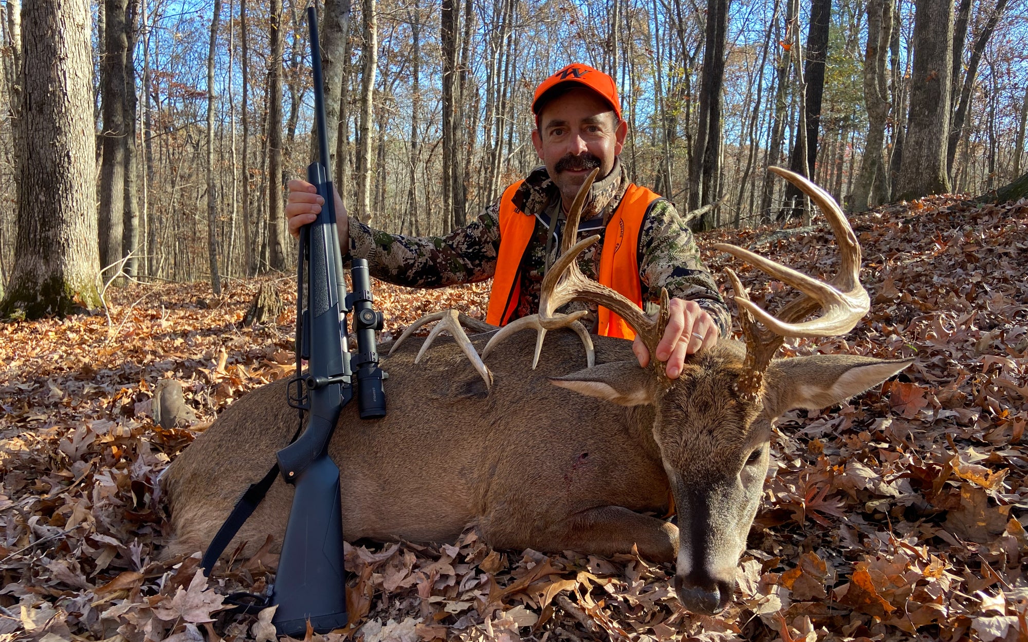 hunter with xpr left hand rifle and deer